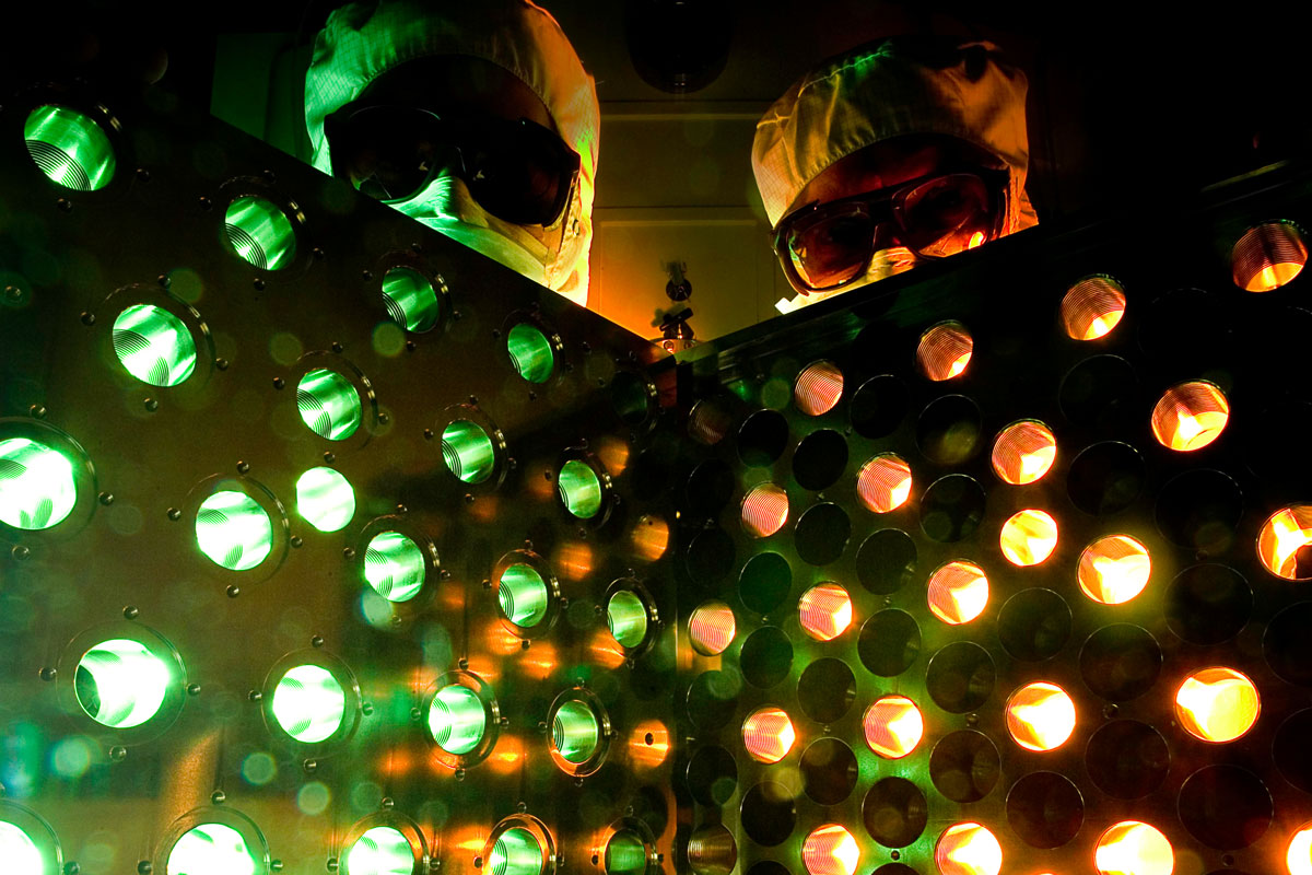 Two researches at the University of Rochester pose infront of an eform mirror.