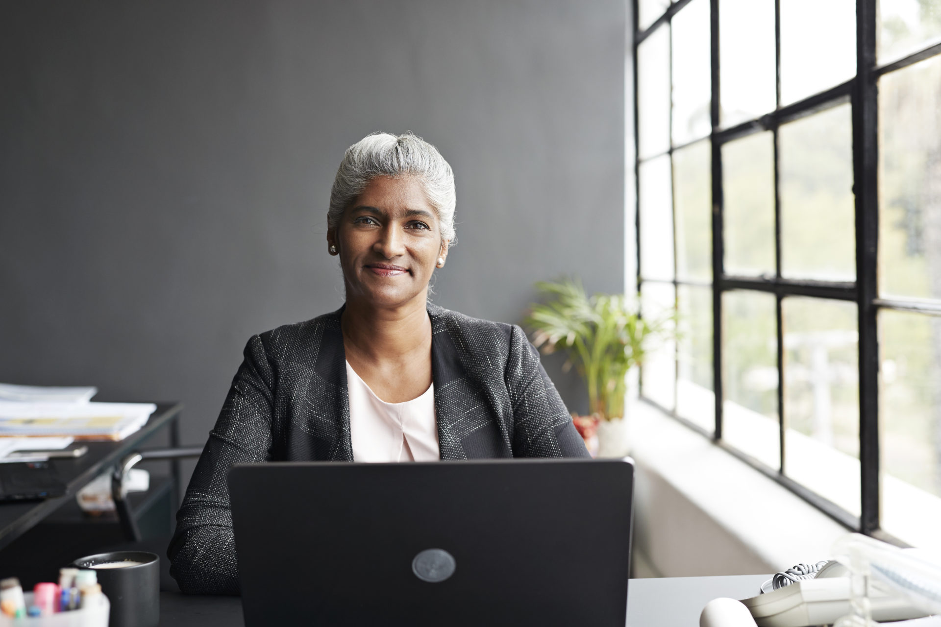 Woman working on a computer at her desk
