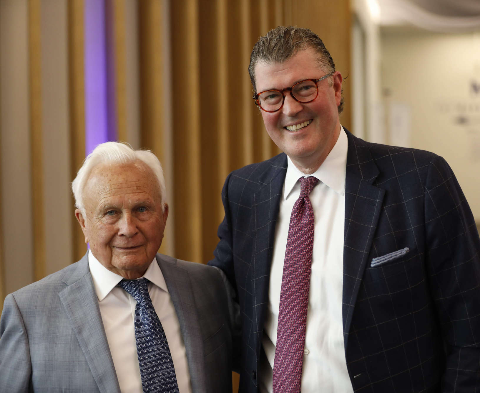 Philip Saunders and Michael Maloney stand side by side and smile at the camera.