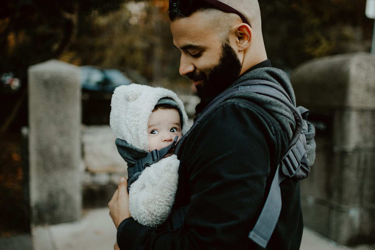 Dad wearing his baby in a carrier