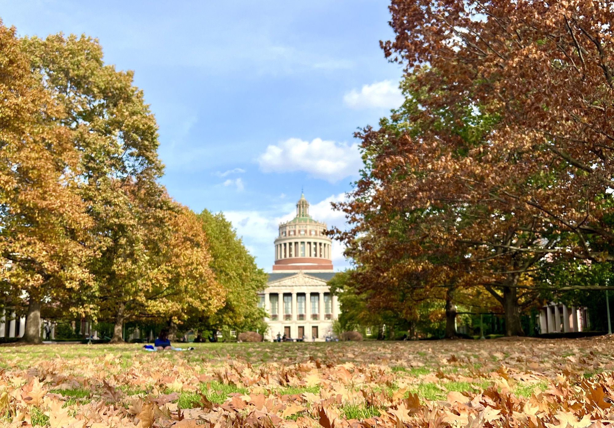 Rush Rhees Library stands out among the fall foliage