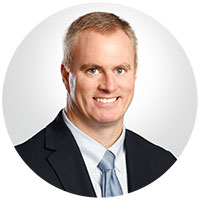 Mike Fahy - man with short hair, wearing a dark suit
