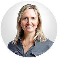 Martha Krohn - blond straight hair wearing gray shirt